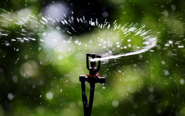 Water spray from irrigation equipment